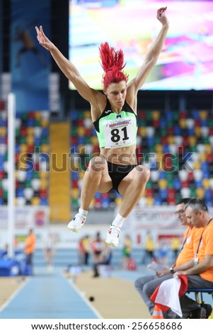 ISTANBUL, TURKEY - FEBRUARY 21, 2015: Slavonian athlete Kolaric Nina long jump during Balkan Athletics Indoor Championships in Asli Cakir Alptekin Athletics hall.