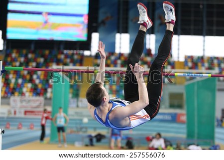 ISTANBUL, TURKEY - FEBRUARY 21, 2015: Moldovan athlete Andrei Miticov high jump during Balkan Athletics Indoor Championships in Asli Cakir Alptekin Athletics hall.