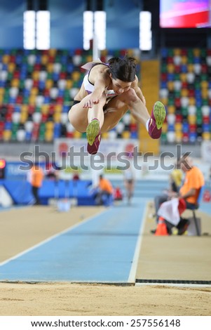 ISTANBUL, TURKEY - FEBRUARY 21, 2015: Israeli athlete Hanna Knyazyva Minenko triple jump during Balkan Athletics Indoor Championships in Asli Cakir Alptekin Athletics hall.