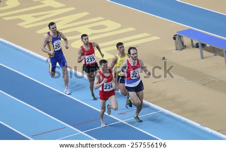 ISTANBUL, TURKEY - FEBRUARY 21, 2015: Athletes running during Balkan Athletics Indoor Championships in Asli Cakir Alptekin Athletics hall.