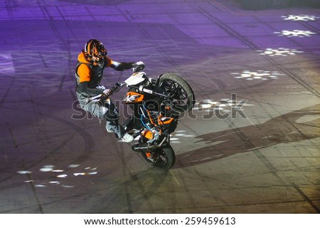 ISTANBUL, TURKEY - JANUARY 31, 2015: Driver Birkan Polat make motorcycle stunt show during Monster Hot Wheels in Sinan Erdem Dome.