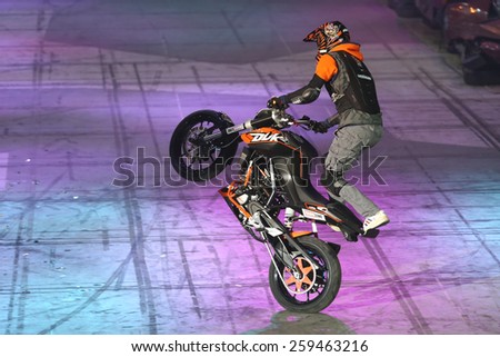 ISTANBUL, TURKEY - FEBRUARY 01, 2015: Driver Birkan Polat make motorcycle stunt show during Monster Hot Wheels in Sinan Erdem Dome.