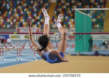 ISTANBUL, TURKEY - FEBRUARY 01, 2015: Athlete Merve Menekse high jump during Turkish Athletic Federation Olympic Threshold Indoor Competitions in Asli Cakir Alptekin Athletics hall