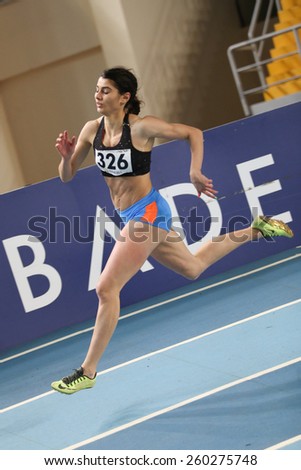 ISTANBUL, TURKEY - FEBRUARY 14, 2015: Athlete Berfe Sancak run during Turkcell Juniors and Seniors Athletics Turkey Indoor Championship in Asli Cakir Alptekin Athletics hall