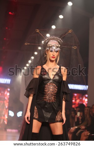 ISTANBUL, TURKEY - MARCH 18, 2015: Turkish model Cagla Sikel showcases one of the latest creations by Hakan Akkaya in Mercedes-Benz Fashion Week Istanbul