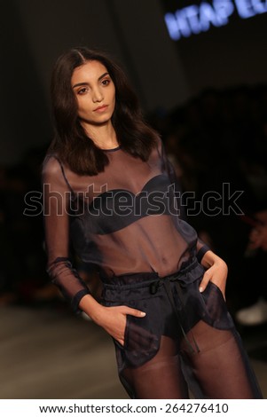 ISTANBUL, TURKEY - MARCH 19, 2015: A model showcases one of the latest creations by Mehtap Elaidi in Mercedes-Benz Fashion Week Istanbul