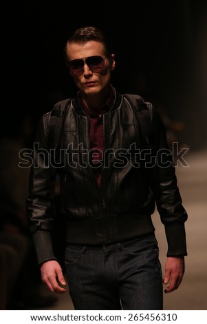 ISTANBUL, TURKEY - MARCH 21, 2015: A model showcases one of the latest creations by Porsche Design in Mercedes-Benz Fashion Week Istanbul
