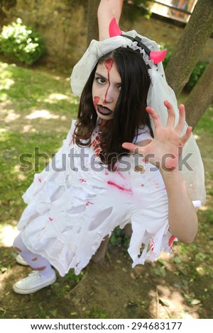 ISTANBUL, TURKEY - MAY 10, 2015: A girl in wedding dress during zombie walk Istanbul in Nisantasi Park