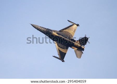 ISTANBUL, TURKEY - MAY 17, 2015: Turkish Air Force Solo Aerobatics Display Team Solo Turk performs. Solo Turk airplane is a F-16 C Blok-40 fighter jet.
