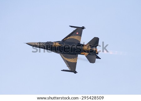 ISTANBUL, TURKEY - MAY 17, 2015: Turkish Air Force Solo Aerobatics Display Team Solo Turk performs. Solo Turk airplane is a F-16 C Blok-40 fighter jet.