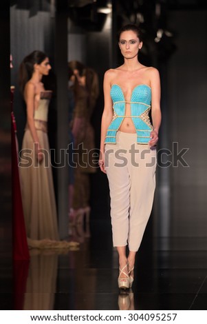 ISTANBUL, TURKEY - NOVEMBER 20, 2014: A model showcases one of the latest creations by Ezra and Tuba in Fashionist fashion fair