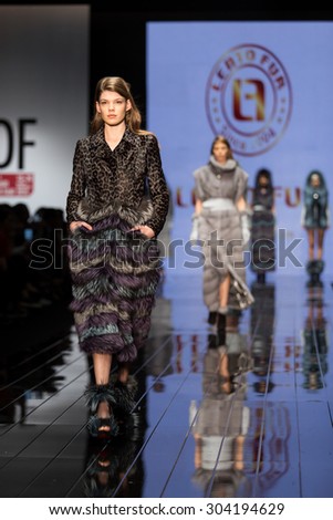 ISTANBUL, TURKEY - NOVEMBER 20, 2014: Models showcase one of the latest fashion creations in Istanbul Leather Fair