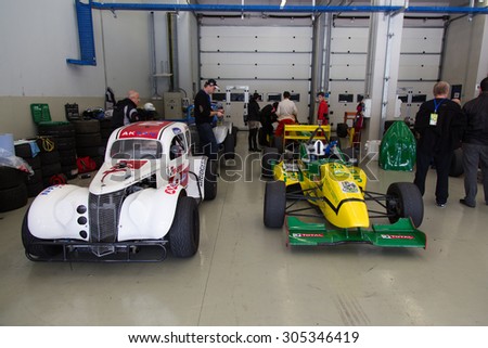 ISTANBUL, TURKEY - NOVEMBER 02, 2014: Formula Alfa and Legends car in garage during Turkish Touring Car Championship in Istanbul Park Circuit