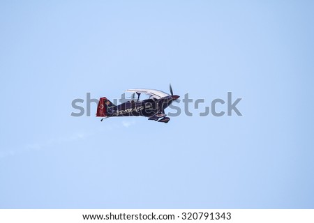 ISTANBUL, TURKEY - AUGUST 02, 2015: Ali Ismet Ozturk piloting his special biplane called Purple Violet at the TATCA Airfest 2015