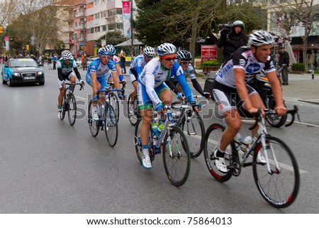 ISTANBUL - APRIL 24: Cyclists in action during the 1st stage of 47th Presidential Cycling Tour of Turkey on April 24, 2011 in Istanbul, Turkey.