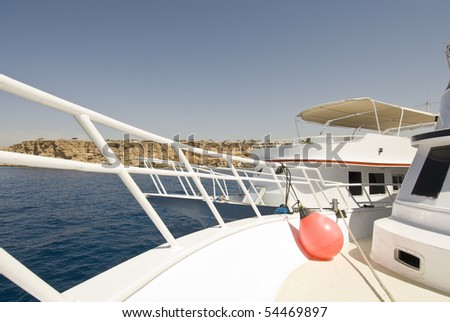 Wide-angle view of a white dive-boat\'s bow. Sharm el Sheikh, Red Sea, Egypt.