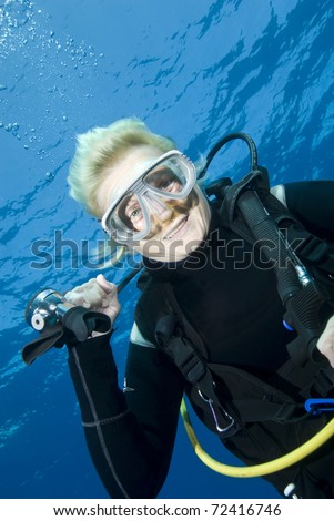 Middle-aged female scuba diver smiling into the lens. Tower, Sharm el Sheikh, Red Sea, Egypt.