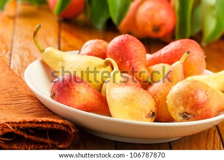 pears on a plate on wooden table