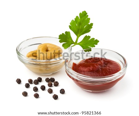 ketchup and mustard in bowls against white background