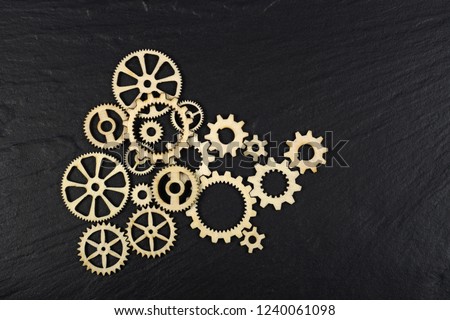 Gears on black background. Conceptual image of industry, mecanics, connection or team work.