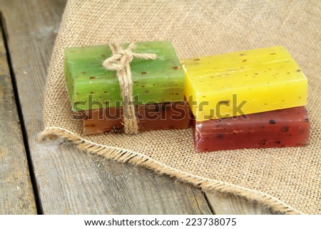 Colorful natural herbal soaps on burlap,