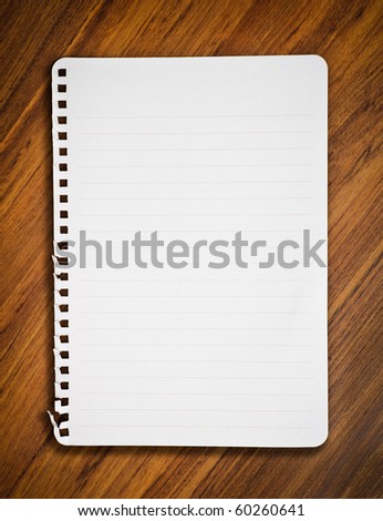 notebook paper on wood floor