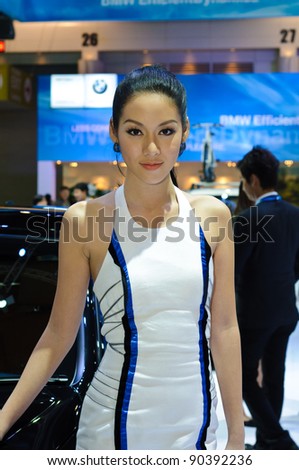 BANGKOK - DECEMBER 7: An unidentified female presenter models at BMW booth during Thailand International Motor Expo 2011 at Impact Challenger on December 7, 2011 in Bangkok, Thailand.