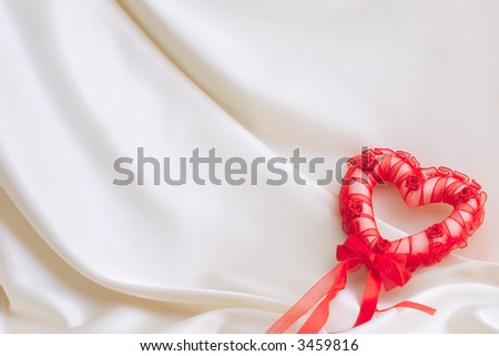 red heart on a silk background