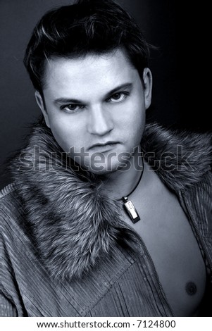 Young attractive the man. A studio portrait black-and-white