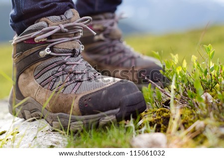 two tramping boots bevore mountain landscape