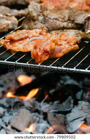 Meat is prepared on the grill