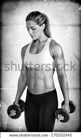 Textured Female Body Builder holding weights