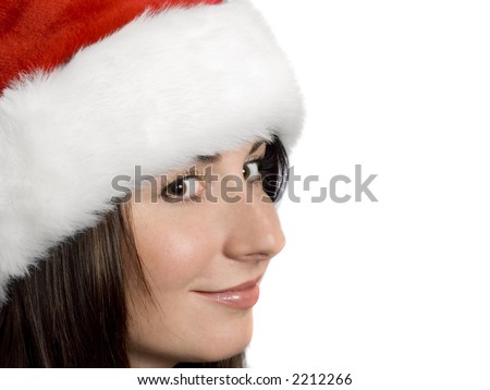 Woman wearing a santa hat smirking