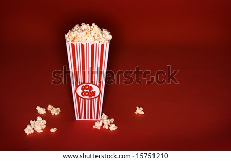 Buttered Popcorn in classic bucket on red background
