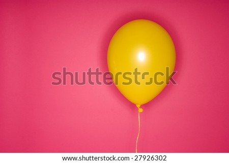 yellow balloon on pick background
