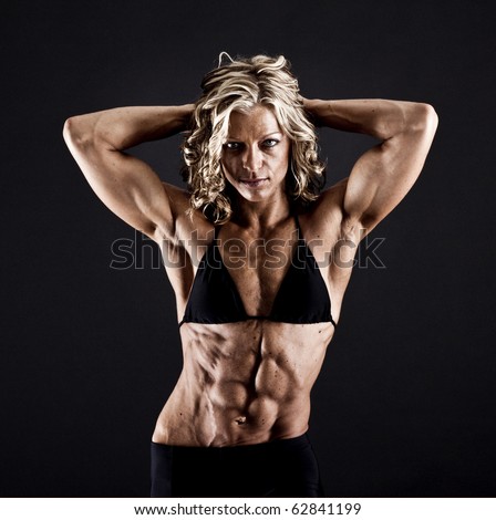stock photo : Female bodybuilder with solid defined abs