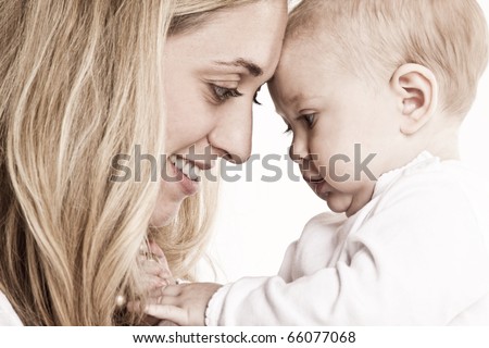 Mother and baby girl smiling
