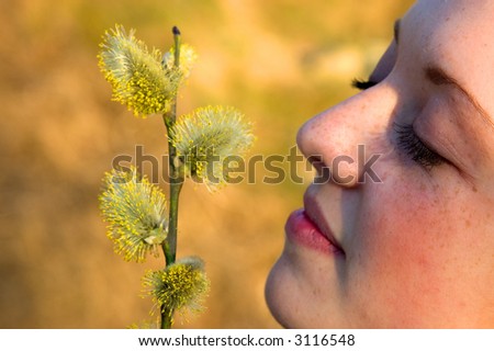 Girl smelling allergic flower