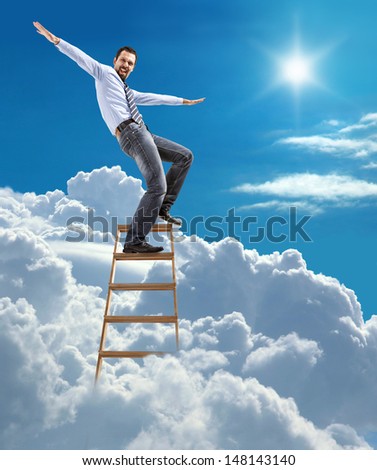 young confident businessman standing at the ladder high in the sky balancing on top / young man in shirt and tie pulls his arms out to the side like an airplane on top of the ladder on heaven