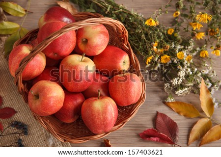 Wicker basket of apples / studio shot of ripe apples in a wicker basket