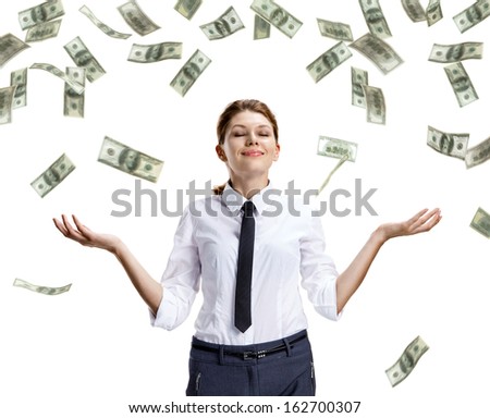 Dream of raining money / studio shoot of beautiful attractive business woman under money rain - isolated on white background