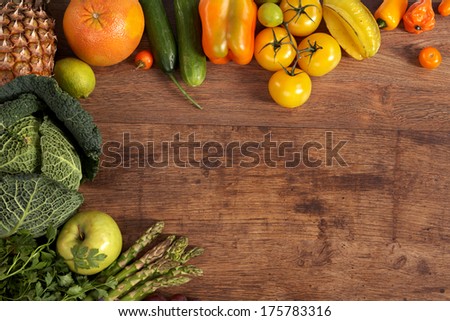 Healthy food background / studio photography of different fruits and vegetables on old wooden table