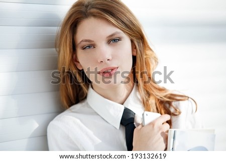 Corporate culture model / women in a white  shirt with tie.
