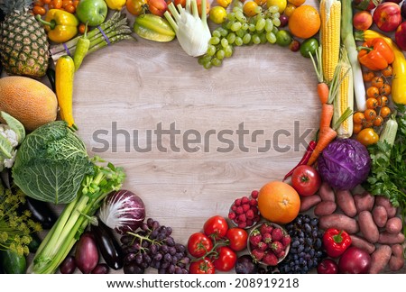 Heart shaped food / food photography of heart made from different fruits and vegetables on wooden table