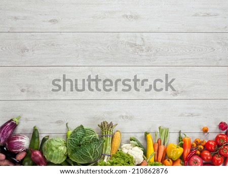 Healthy food background / studio photography of different fruits and vegetables on wooden table