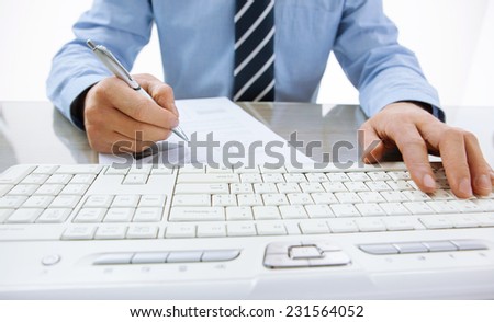 Financial report, budgeting, planning / close-up photo of successful accountant working with computer keyboard in the office