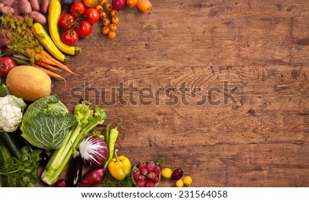 Healthy food background / studio photo of different fruits and vegetables on old wooden table