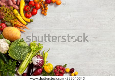 Healthy food background / studio photo of different fruits and vegetables on wooden table