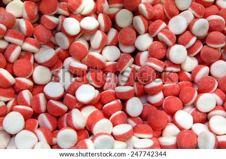 Many bright color jelly candies / close-up of a lot of bicolor candies for background