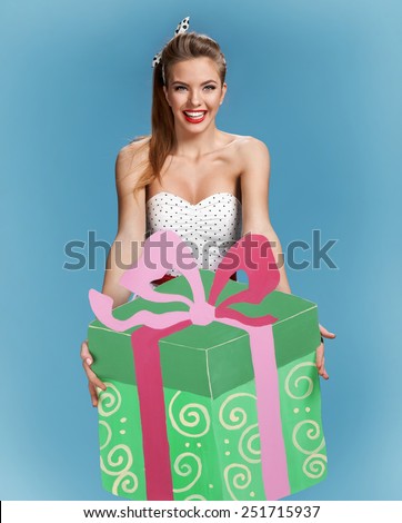 Birthday girl with large green gift box / set photos of beautiful young retro pinup woman on blue background